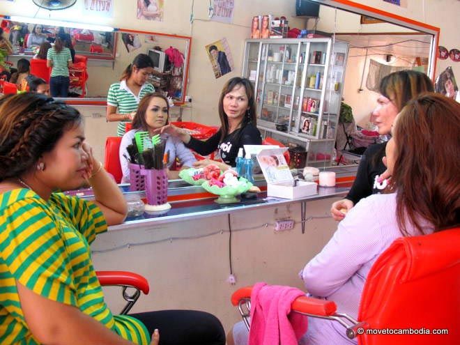 A Cambodian wedding guest gets her hair and makeup done at a Phnom Penh salon.