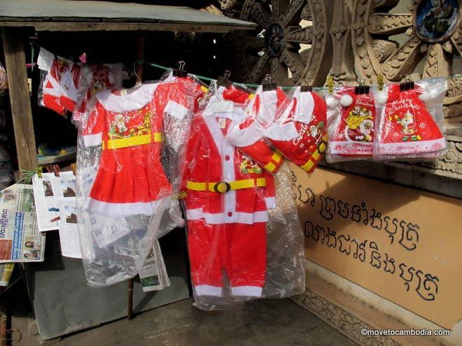 Toddler-sized Santa outfits in Cambodia.