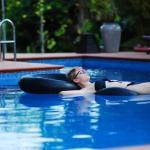 Kristin O'Connell relaxing in a pool