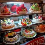 A selection of popular birthday cakes in Cambodia.