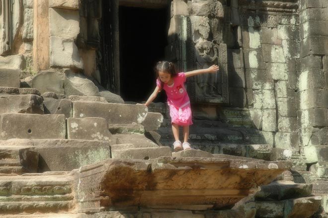 child at Angkorian temples