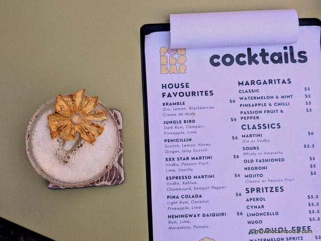 Drinks menu next to a margarita at Pomelo Bar Phnom Penh