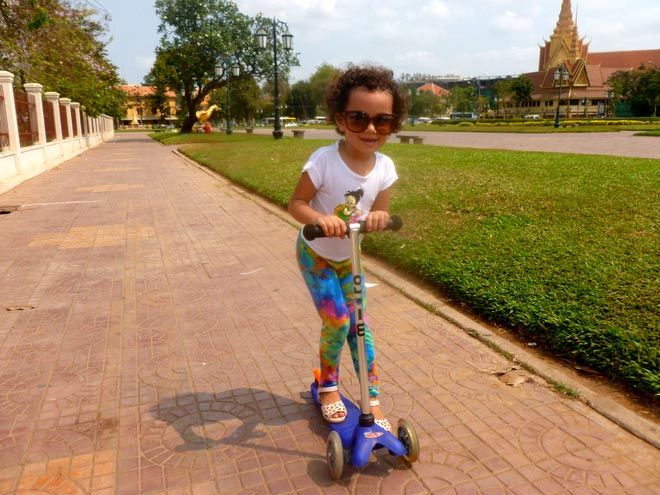 riding a scooter in Wat Botum Park